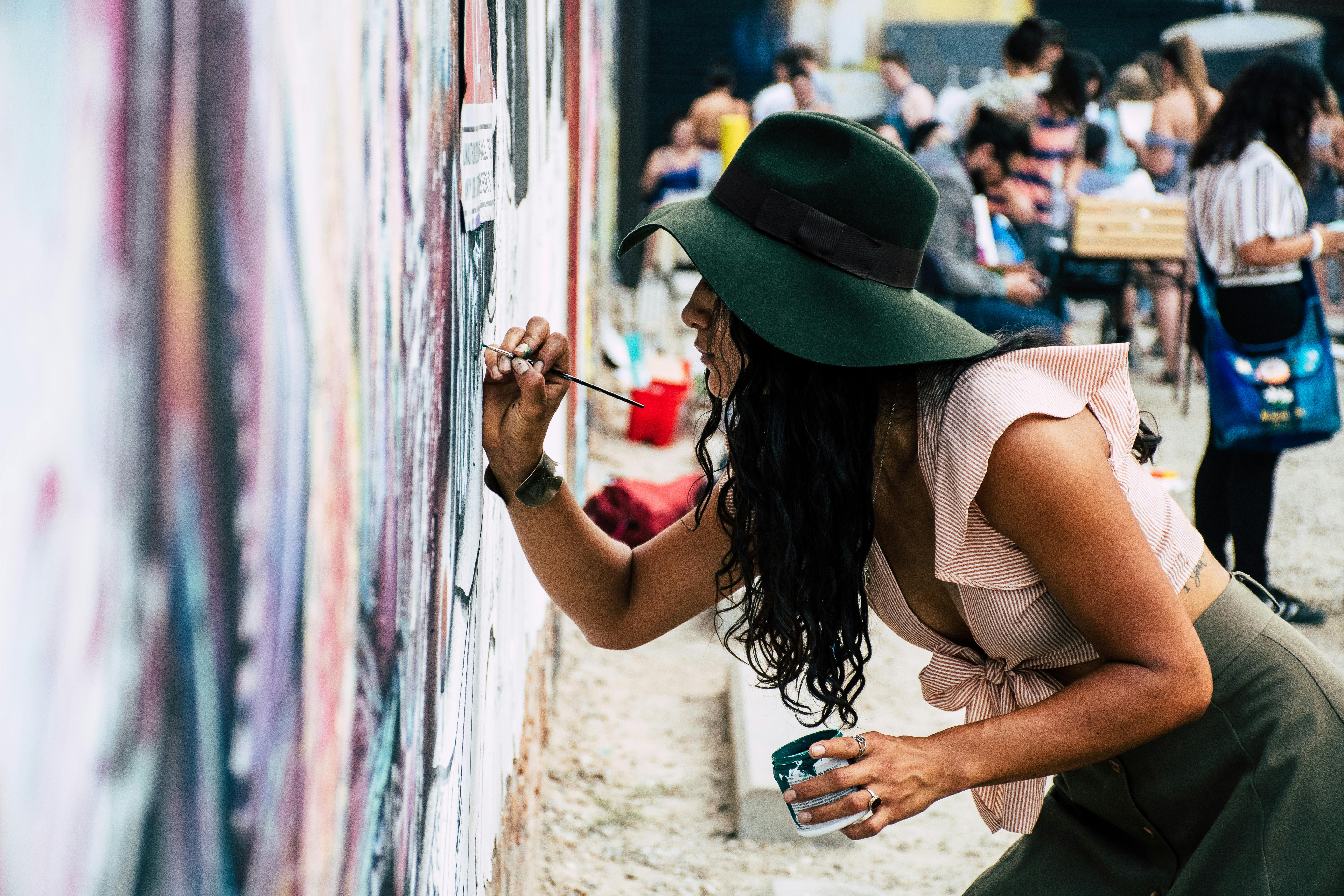 Artist painting a vibrant mural